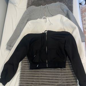 Three cropped zip ups